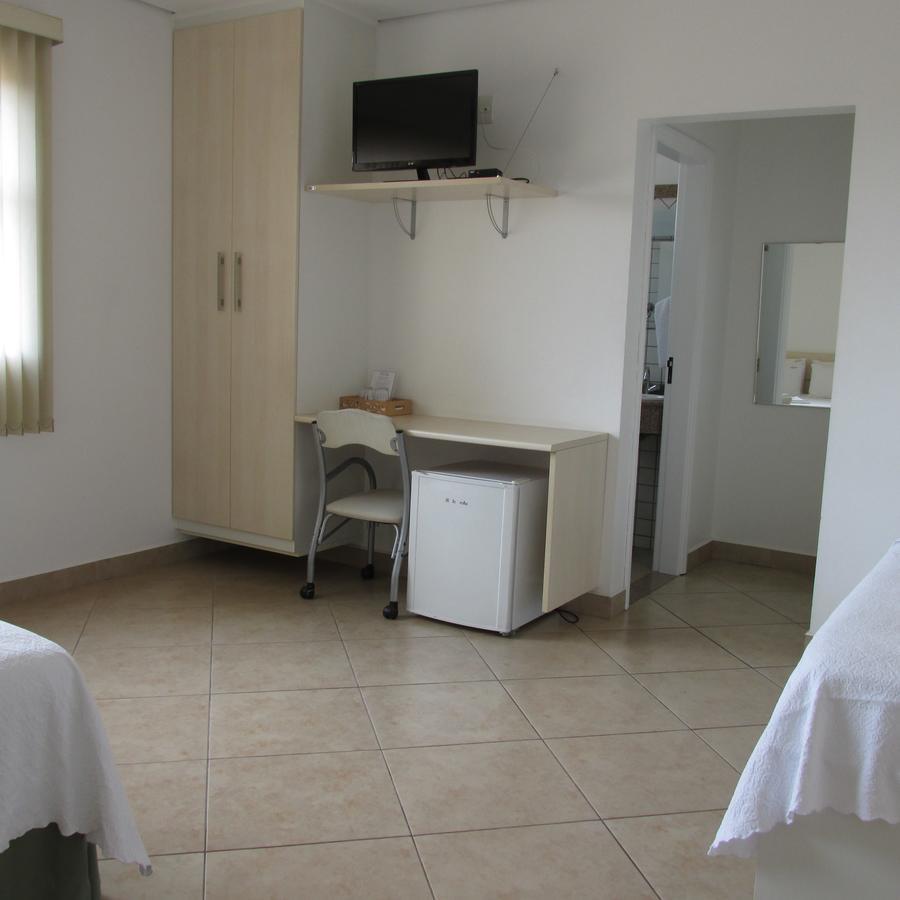Holambra Garden Hotel Exterior photo A typical room at the hostel